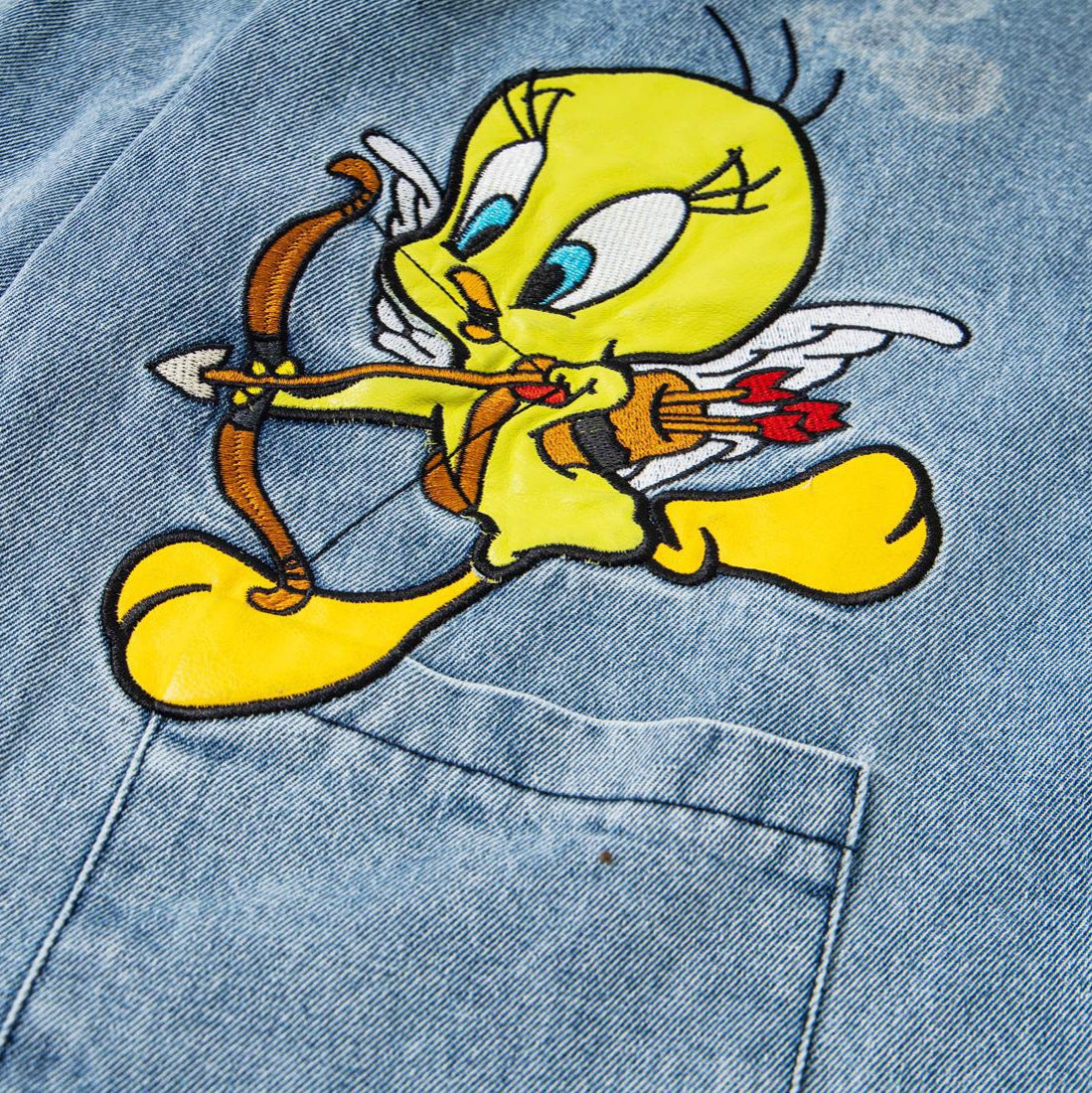Embroidered washed denim jeans
